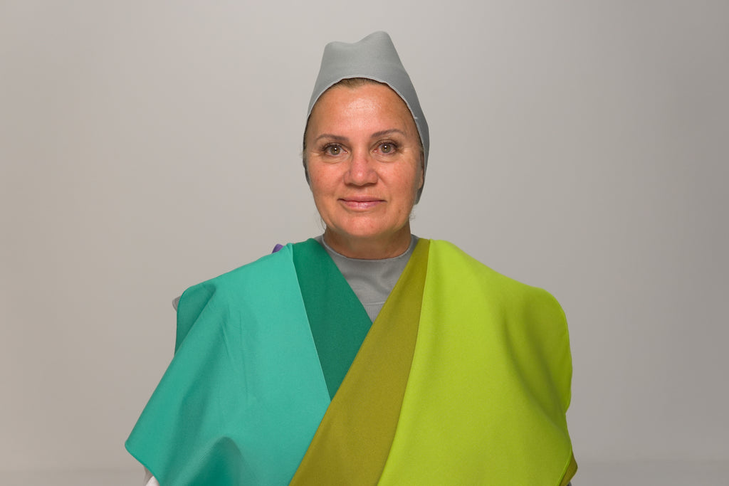 Plain color drape held for a personal color analysis reading