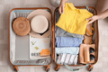 Planned Travel Bag online course: a capsule travel wardrobe packed in a suitcase